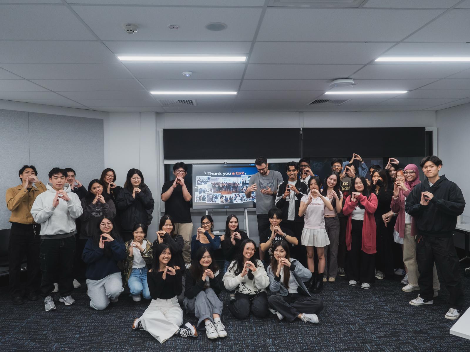 The full Prodigi program cohort gathered together at the end of the sprint, making the AUTHNTCT hand gesture in front of a Thank you a ton slide.