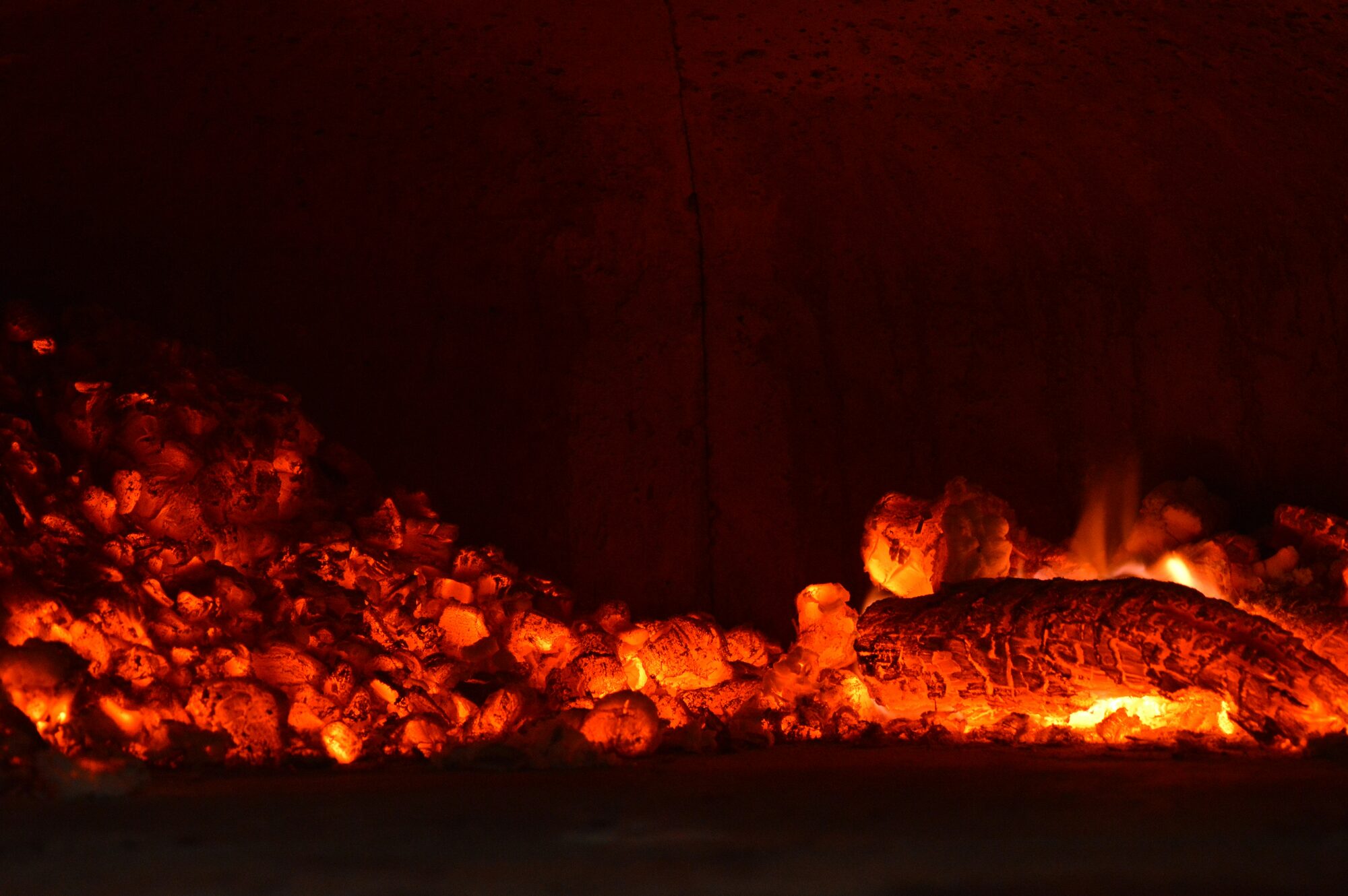 Glowing embers, standing in for the intensity of extreme urban heat.