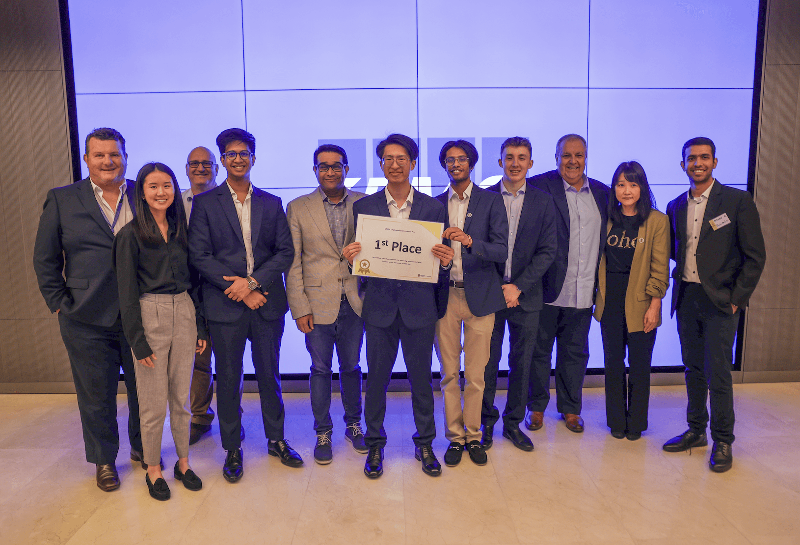 The Sherlocked.ai team holding a first-place certificate at the 2024 Innovator Pro Pitch Fest, KPMG Australia.